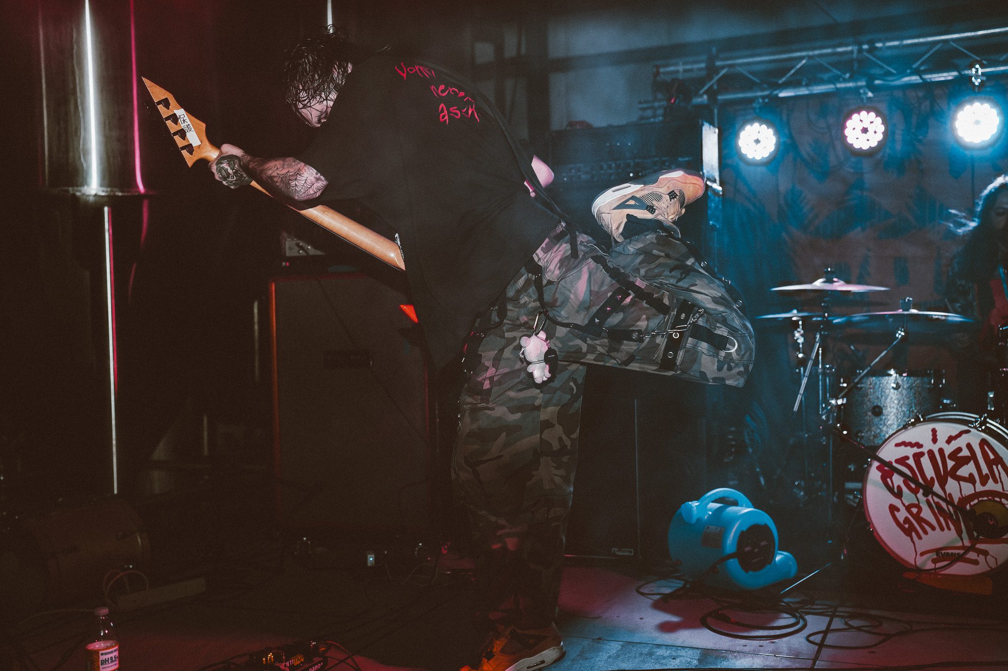 Logo of the band The Modern Era featuring a raised middle finger in a circular design, with text reading 'THE MODERN ERA MINNEAPOLIS, MN'.