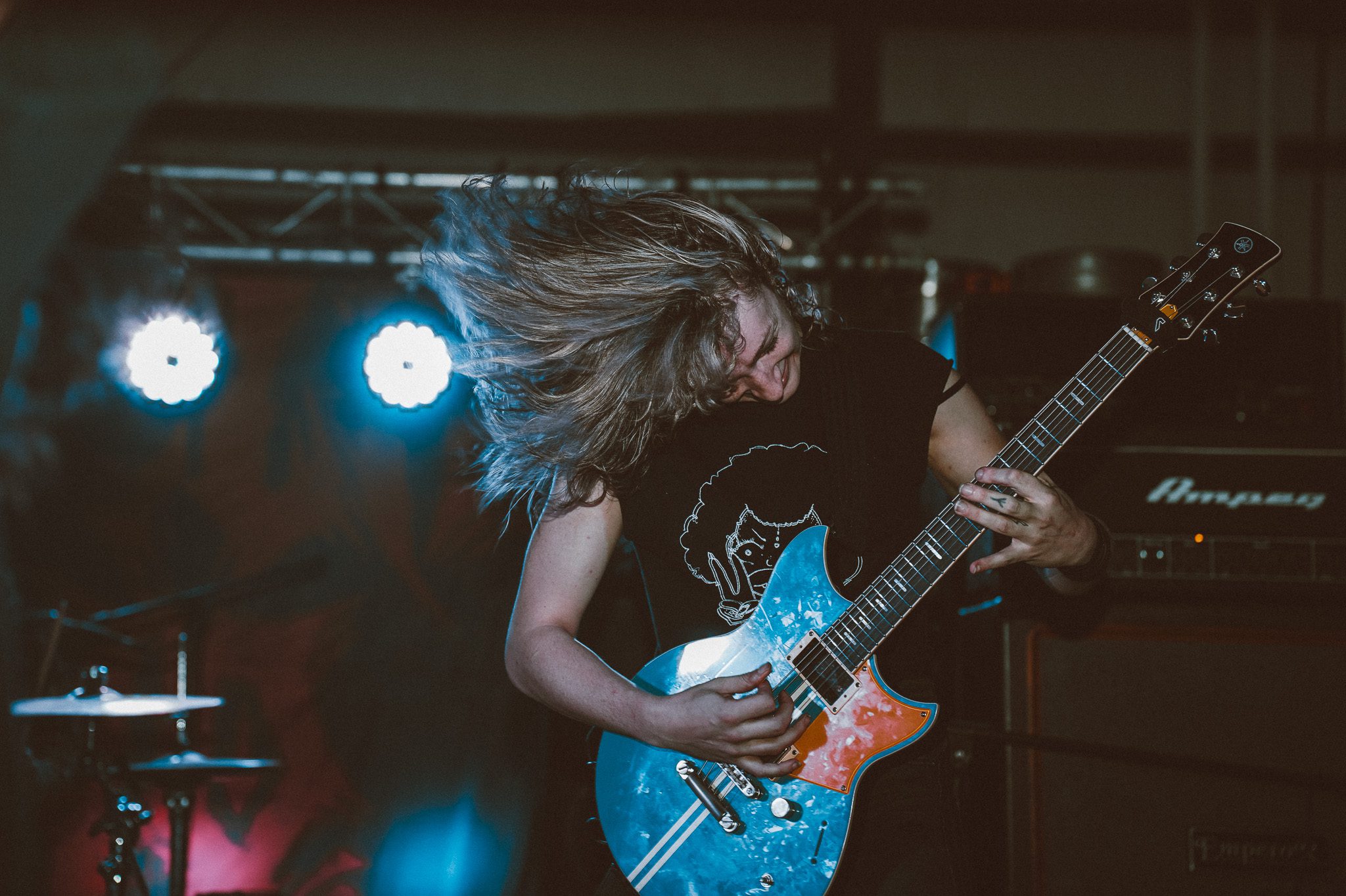 Logo for the Rhythm Waves festival featuring colorful text design with the festival name in various styles and bold fonts.