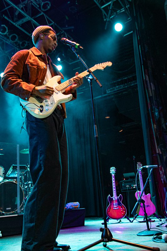 Musician on stage playing guitar during a performance at the House of Blues in Cleveland, Ohio.