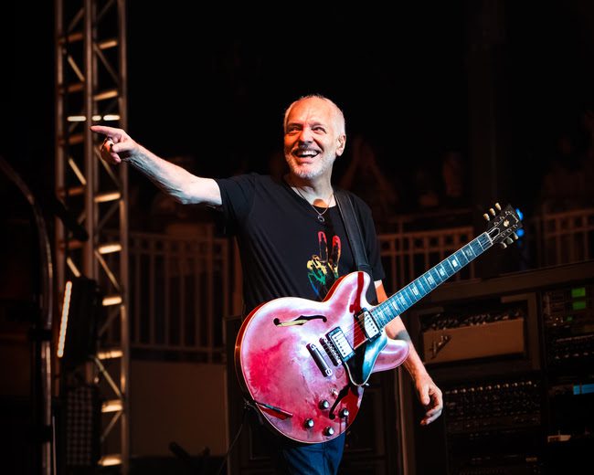 Peter Frampton live on stage with guitar