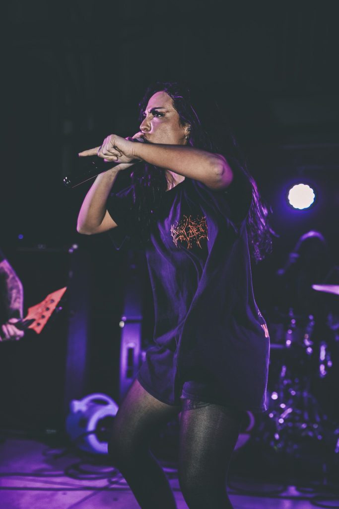 Festival poster for Rhythm Waves featuring the line-up announcement including artists like Ken Carson, Gunna, Chase & Status, and many others, with event dates and location details.