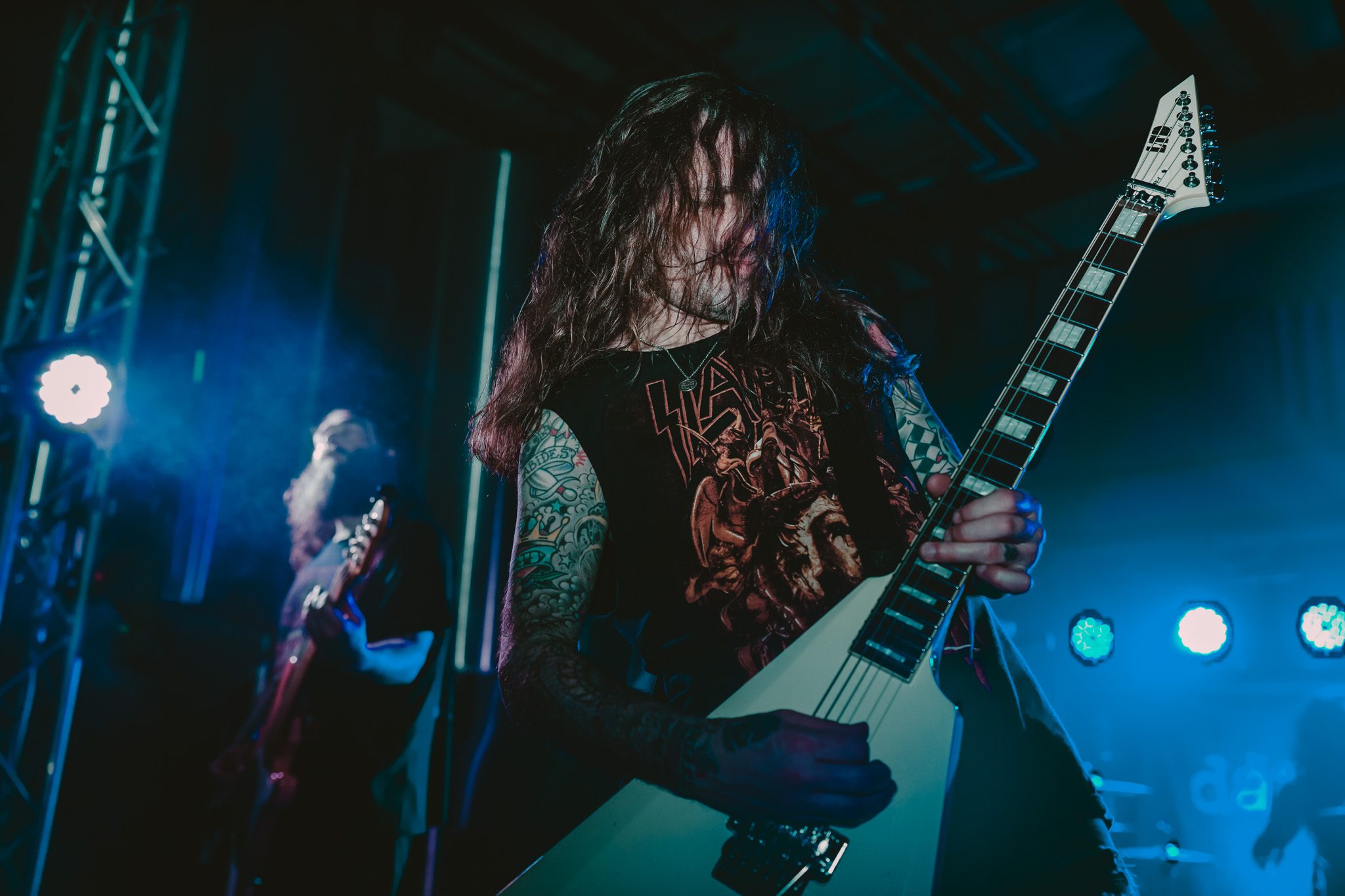 Logo for the Man 2 Man initiative featuring two hands clasped in solidarity, accompanied by the text 'URBAN YOUTH ADVOCATE' and 'MAN 2 MAN'.