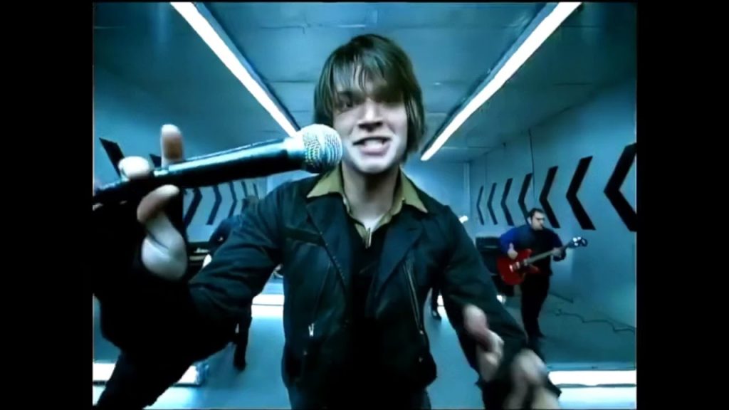 Taking Back Sunday performing during the early 2000s emo scene era