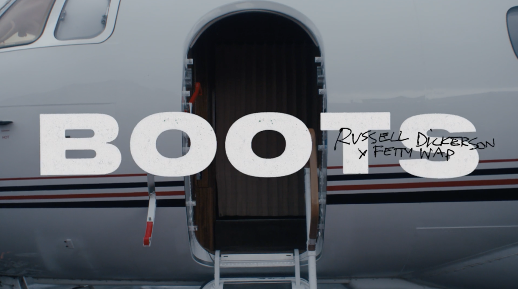 Russell Dickerson and Fetty Wap relive their viral CMA Fest moment in “BOOTS” music video