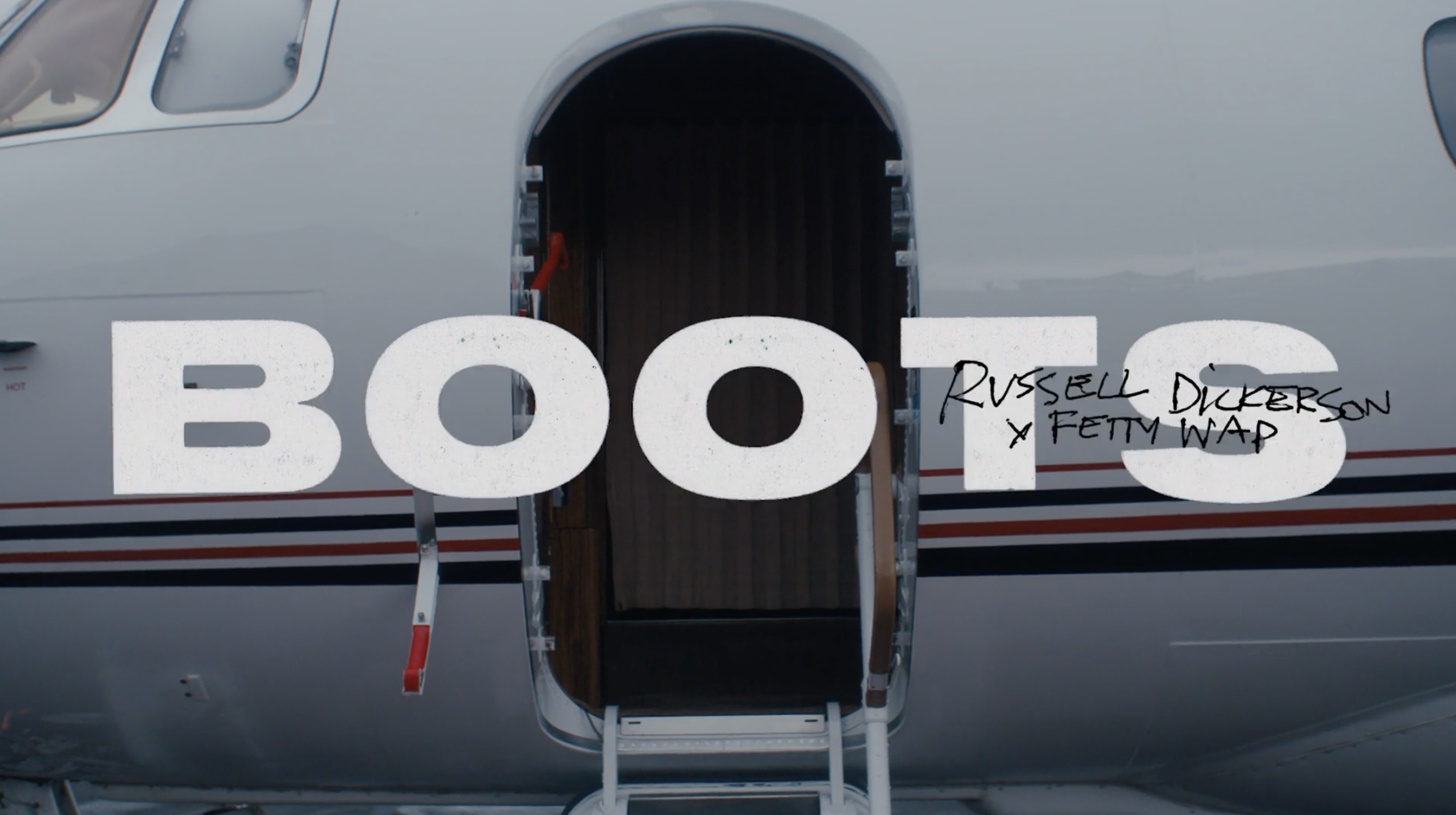 Russell Dickerson and Fetty Wap relive their viral CMA Fest moment in “BOOTS” music video
